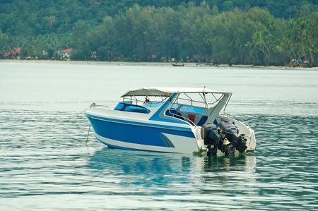 Boat - a speed boat on blue water