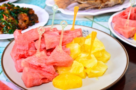 pineapple, watermelon on dishの写真素材