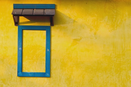 Yellow grunge wall with blur frame windowの写真素材