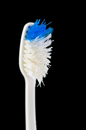 Old toothbrush. isolated on blackの写真素材