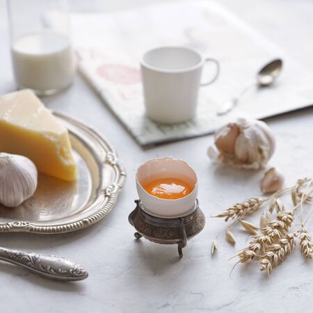 Country breakfast in vintage dishes on a white background, Egg, cheese, garlic, coffee