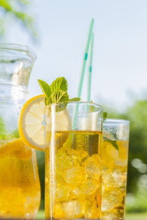 cold summer drinks in gardenの写真素材