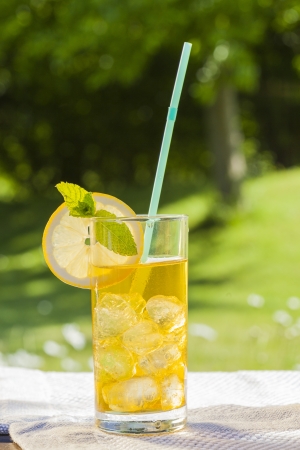 cold summer drinks in gardenの写真素材