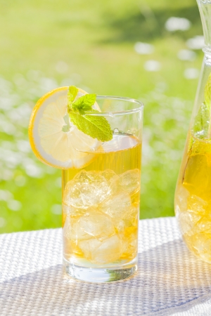 cold summer drinks in gardenの写真素材