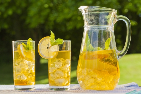 cold summer drinks in gardenの写真素材
