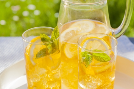 cold summer drinks in gardenの写真素材