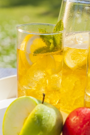 cold summer drinks in gardenの写真素材