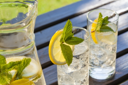 cold summer drinks in gardenの写真素材