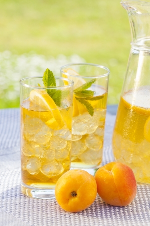 cold summer drinks in gardenの写真素材