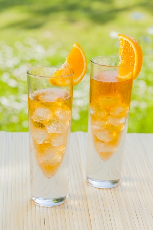 cold summer drinks in gardenの写真素材