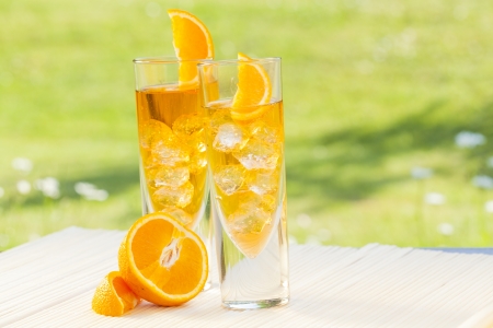 cold summer drinks in gardenの写真素材
