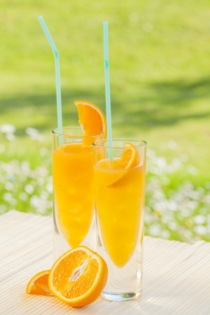 cold summer drinks in gardenの写真素材