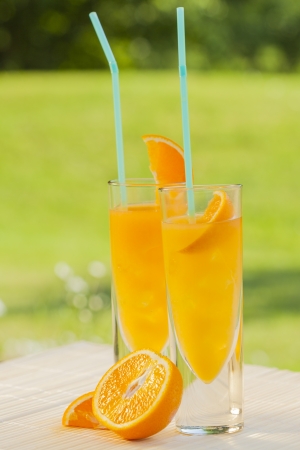 cold summer drinks in gardenの写真素材