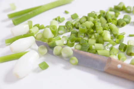 chopped scallions and knife for summer saladの写真素材