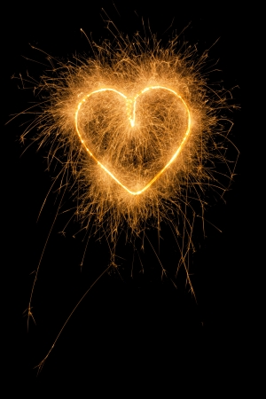 burning firework heart from sparklersの写真素材