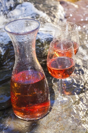 delicious fresh rose wine chilled in waterfallの写真素材
