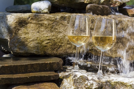 delicious fresh white wine chilled in waterfallの写真素材