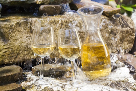 delicious fresh white wine chilled in waterfallの写真素材