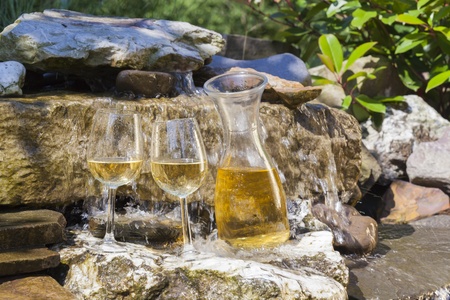 delicious fresh white wine chilled in waterfallの写真素材