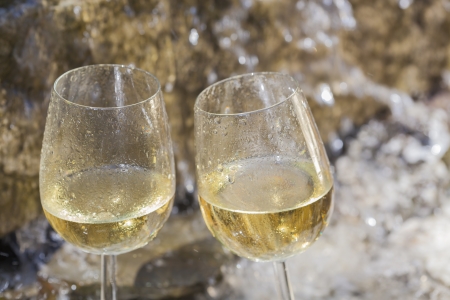 delicious fresh white wine chilled in waterfallの写真素材