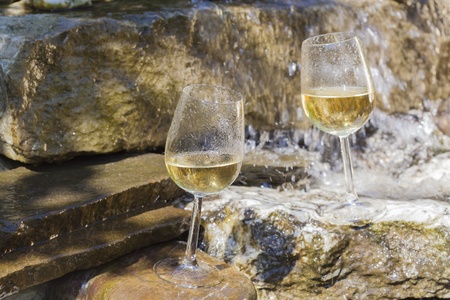 delicious fresh white wine chilled in waterfallの写真素材