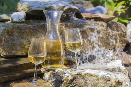 delicious fresh white wine chilled in waterfallの写真素材