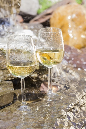 delicious fresh white wine chilled in waterfallの写真素材