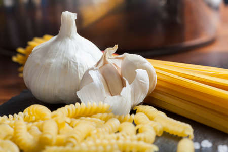 italian food mediterranean cooking pasta still life different kinds of pasta cheese and olive oilの写真素材