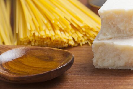 italian food mediterranean cooking pasta still life different kinds of pasta cheese and olive oilの写真素材