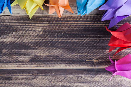 paper tulips on wooden table spring conceptの写真素材