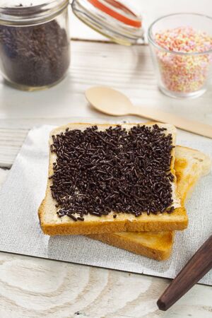 outdoor spring breakfast sweet bread spread on wooden tableの写真素材