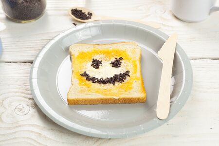 outdoor spring breakfast sweet bread spread on wooden tableの写真素材