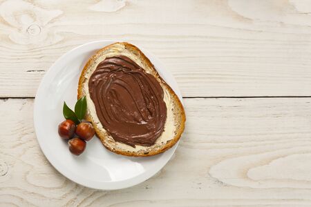 outdoor spring breakfast sweet bread spread on wooden tableの写真素材