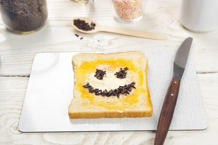 outdoor spring breakfast sweet bread spread on wooden tableの写真素材