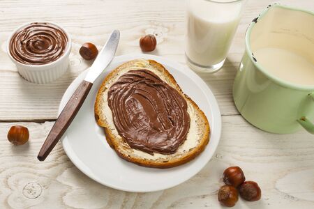 outdoor spring breakfast sweet bread spread on wooden tableの写真素材