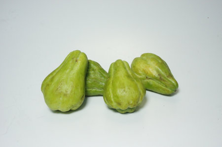 Fresh chayote isolated on white backgroundの写真素材