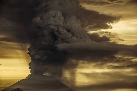 Series of photos from the eruption volcano Agung in Bali. Big smoke and ash cover the skyの写真素材