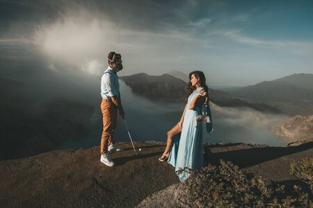 Man in protective masks looks at his woman who seduces himの写真素材