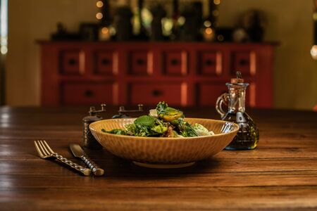Vegetable salad with feta cheese on top of a wooden tableの写真素材