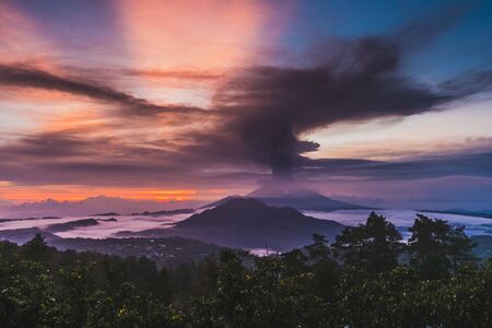 Series of photos from the eruption volcano Agung in Bali with beautiful views of the nature. Big smoke and ash cover the sky の写真素材