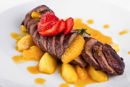 Baked meat in tangerine sauceの写真素材