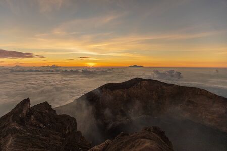 sunrise at the top of agung volcano. crater viewの写真素材
