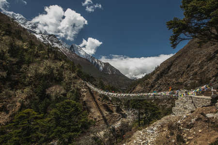 Everest base camp trekking. traditional nepalese bridge.high altitude landscapeの写真素材