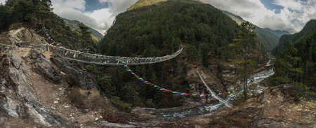 Everest base camp trekking. traditional nepalese bridge.high altitude landscapeの写真素材