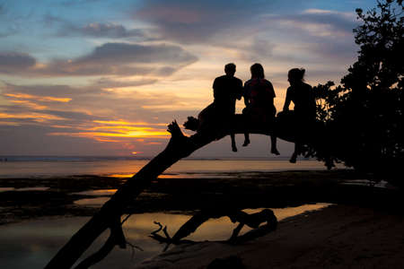 3 men silhouette in sunset