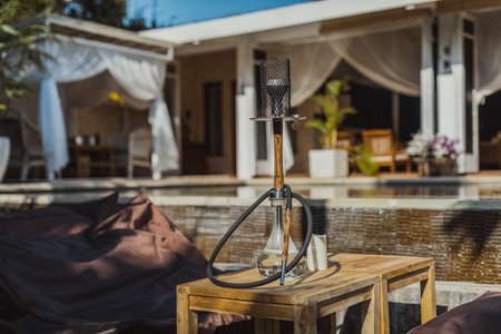 Shisha bar with a sitting bag. Lounge place. hookah in interior. summer time.の写真素材