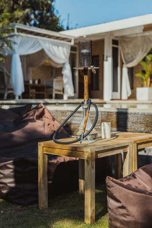 Shisha bar with a sitting bag. Lounge place. hookah in interior. summer time.の写真素材