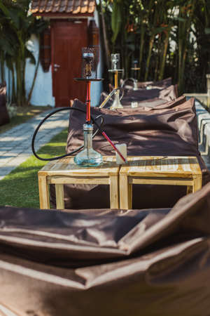 Shisha bar with a sitting bag. Lounge place. hookah in interior. summer time.の写真素材