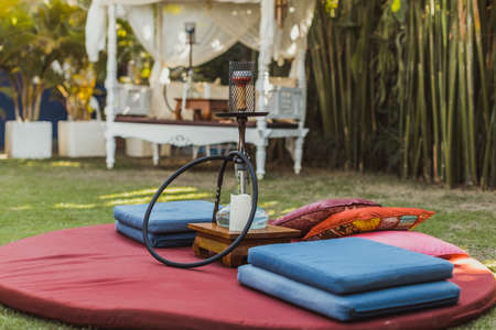 Shisha bar with a sitting bag. Lounge place. hookah in interior. summer time.の写真素材