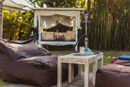 Shisha bar with a sitting bag. Lounge place. hookah in interior. summer time.の写真素材